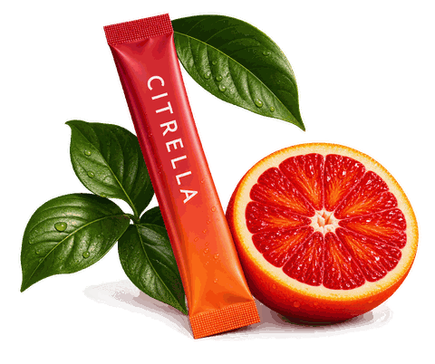 A Citrella sachet resting against a halved blood orange and green leaves